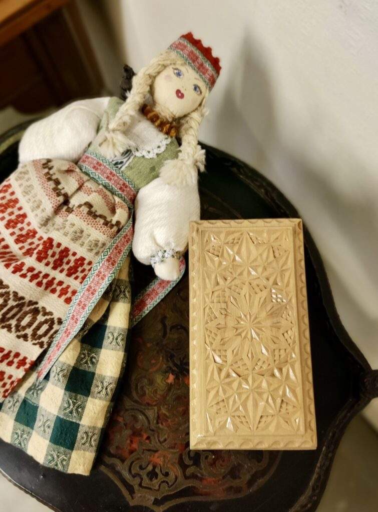 Doll and carved wooden box from the museum