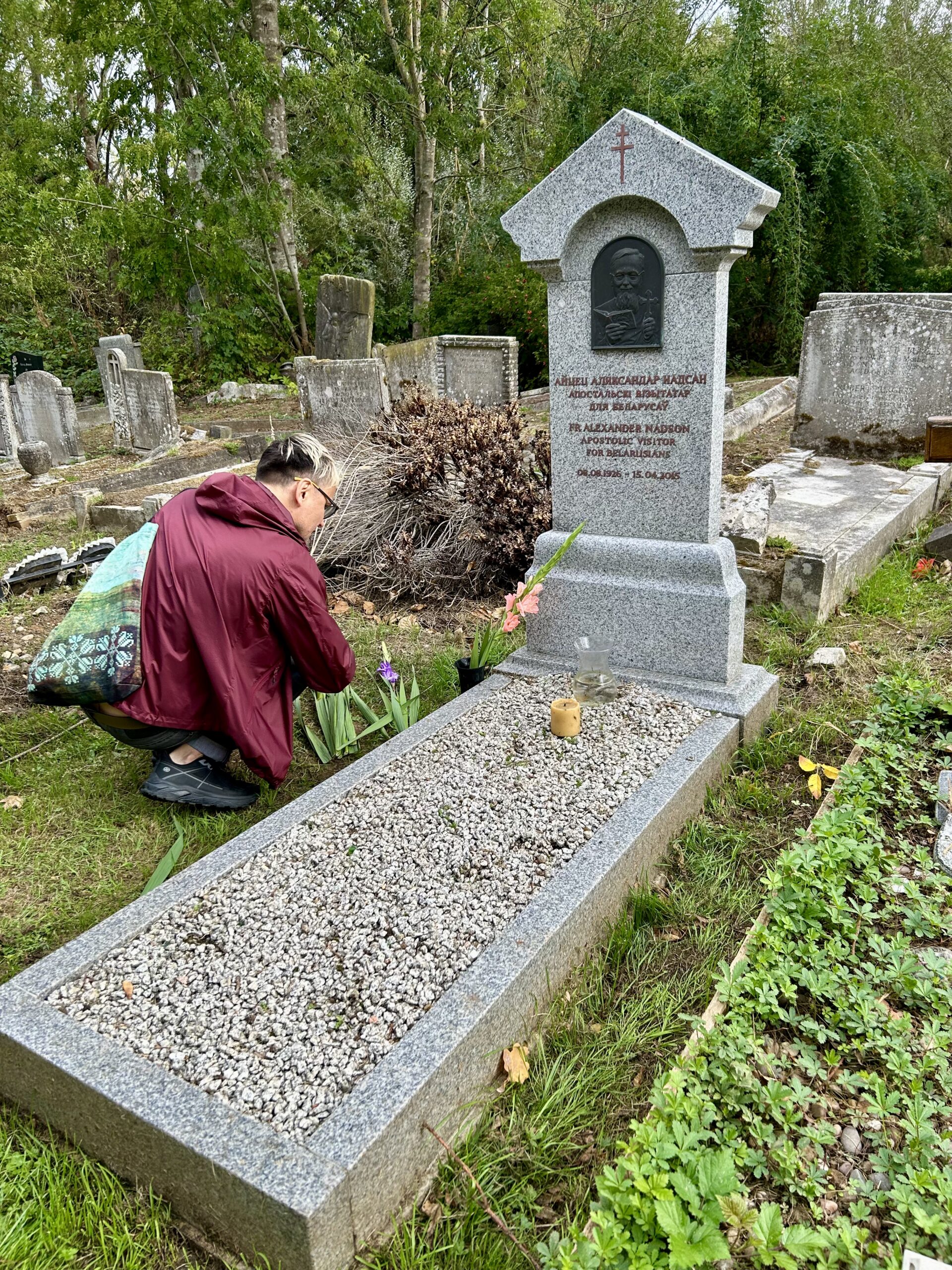 Uładzisłaŭ Harbacki at the grave of Fr Alexander Nadson in North London, 19 September 2026