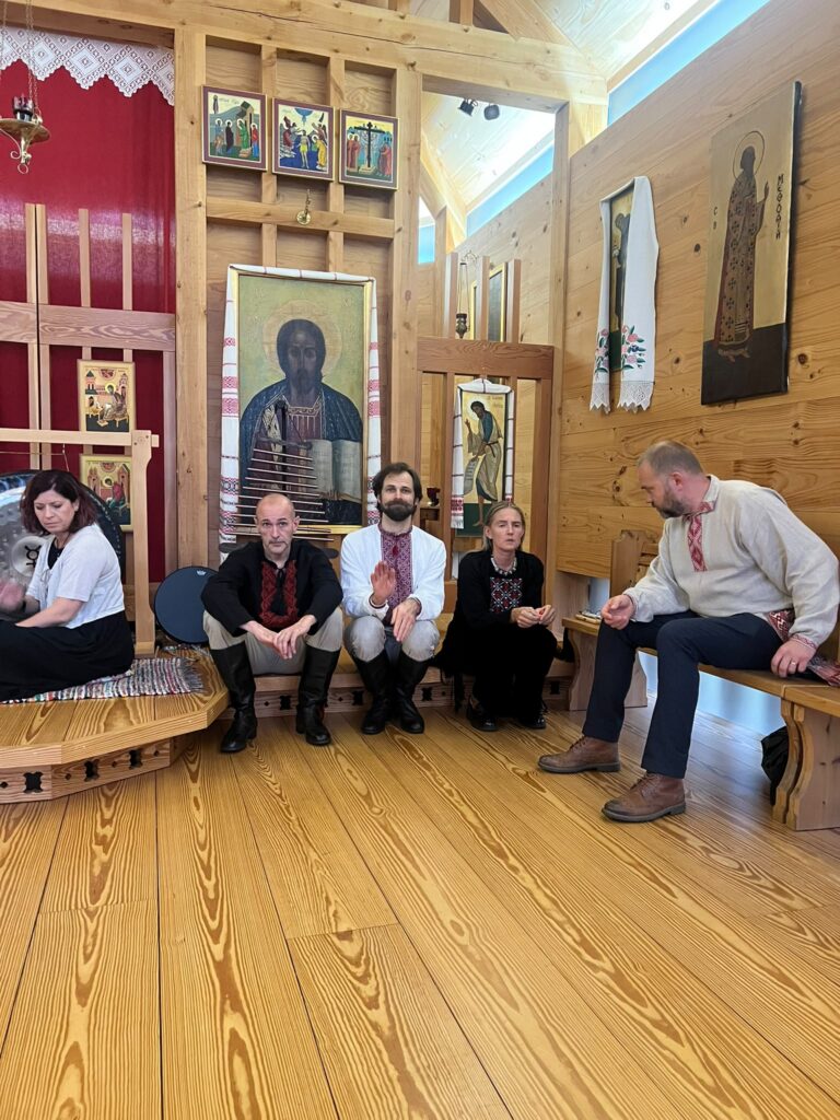 Andrea Kmiacova, Alesia Mańkoŭskaja and members of the Vir folk group during the concert at the Church of St Cyril of Turaǔ, 19 September 2026